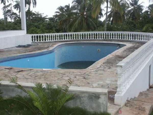 A Dreamy White Villa Overlooking Tropical Green
